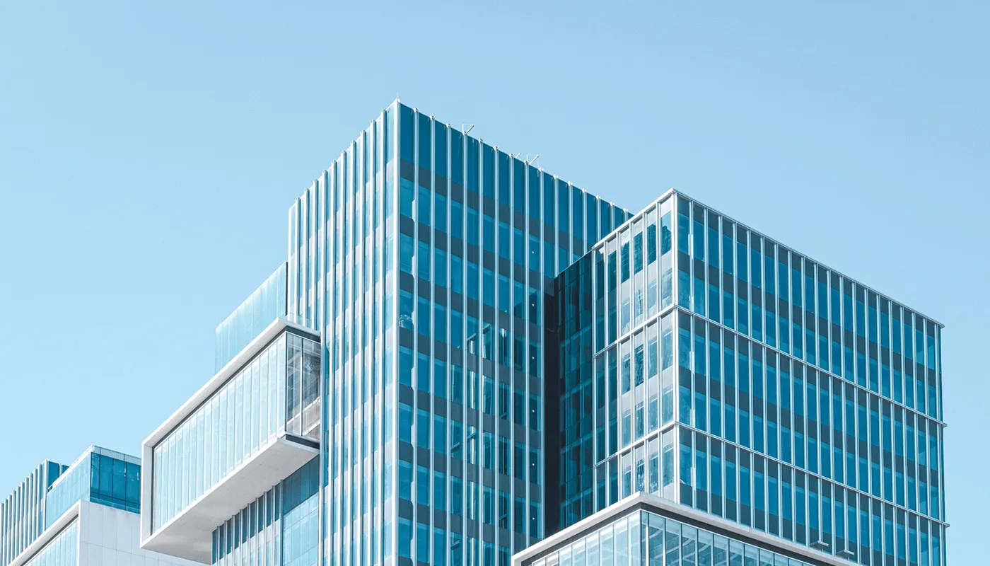 Glass office tower photography used in the ZREX real estate brand